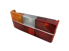 Volvo sedan tail light 240, 244, Taillight Optical Unit  HOUSING ONLY with CHROME Center Molding  Left side/Driver's side1372226 